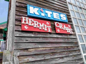 Sign at the Schooner's Wharf where you will find an anchor from the Lucy Evelyn